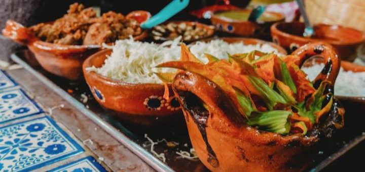 mexican food in clay pots on a counter
