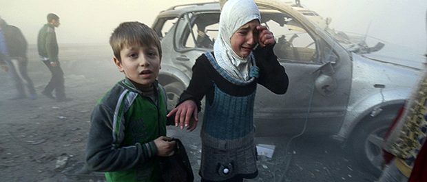 A girl cries near a damaged car at a site hit by what activists