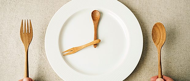 white plate with spoon and fork, Intermittent fasting concept, k