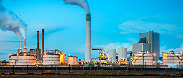 Oil refinery industry at night in Rotterdam, Netherlands. Pollut