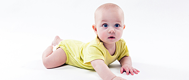 cute baby lying on the background and smiling