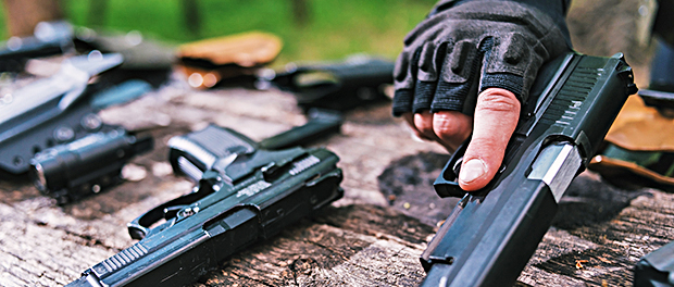 sports shooting instructor check your weapons close-up