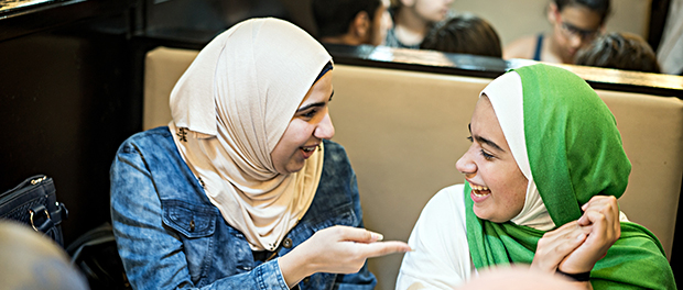 Muslim girls at restaurant having iftar