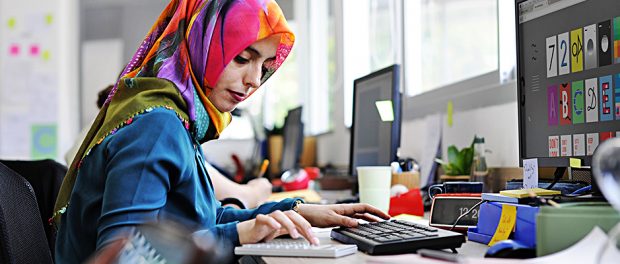 Muslim woman working at the office