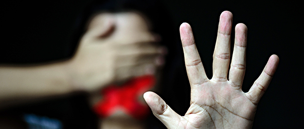 Woman hand sign for stop abusing violence, another hand close ey
