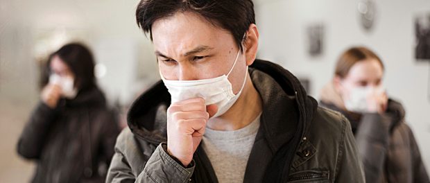 Coronavirus-Virus-Pandemie-Erreger-Husten-Atemschutzmaske-Unschärfe-Menschen