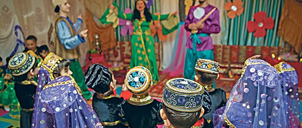 Novruz holiday background . The national costume of the Azerbaijani national hat and cap
