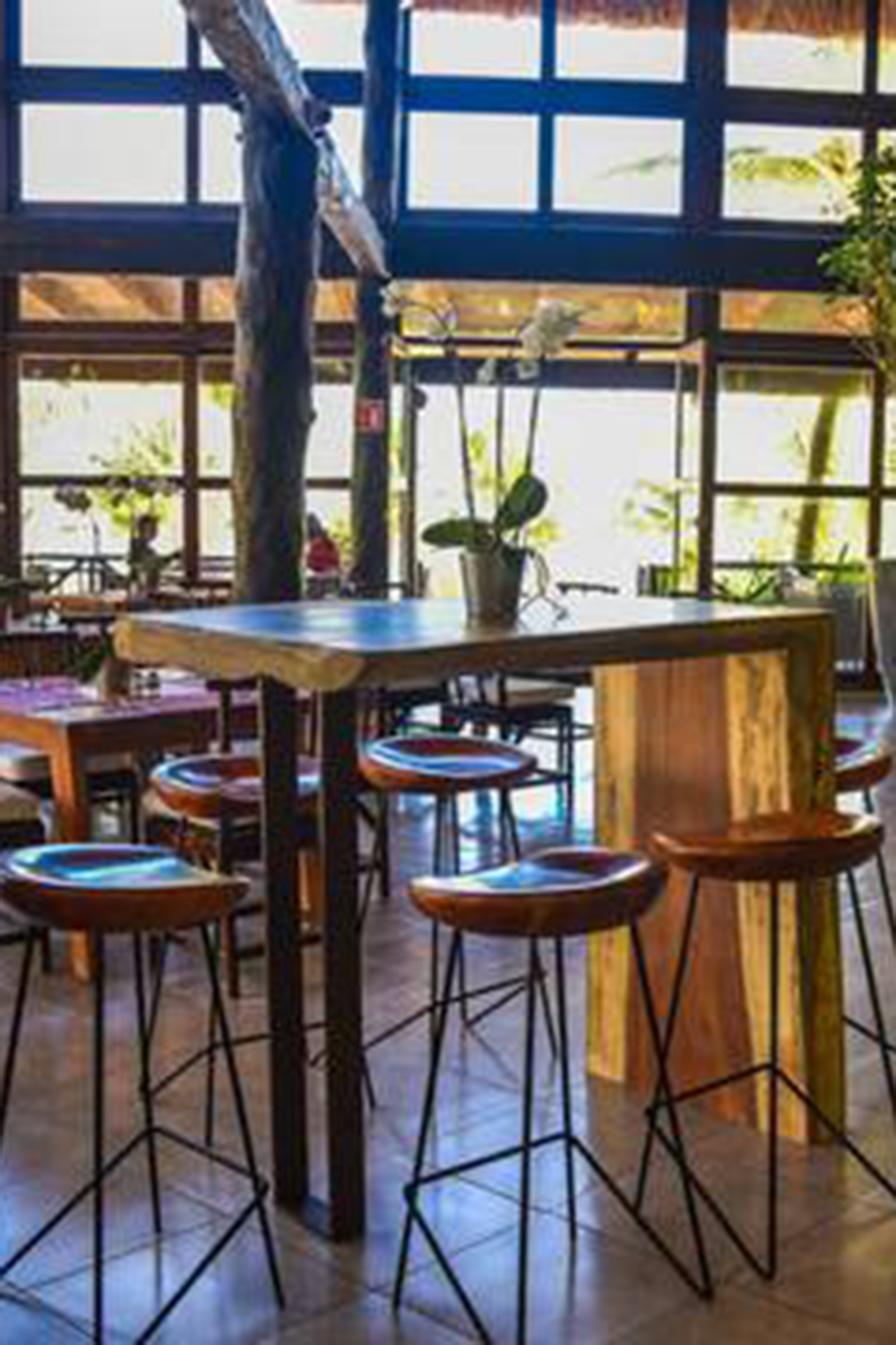 With the dense jungle on its back and the Caribbean sea lying on its feet, this hip meeting point brings together people who love top-notch food, well-crafted cocktails and socialising, always accompanied by positive vibes and good music. - Image