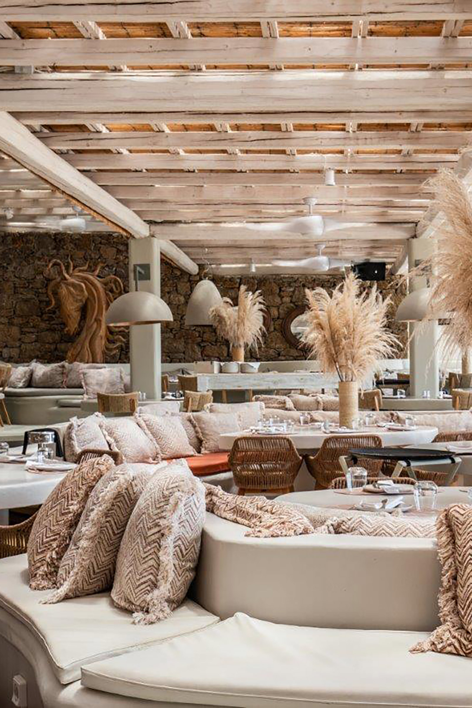 The restaurant serves Mediterranean and Asian cuisine, complemented by a strong wine-list and panoramic sea and beach views. - Image