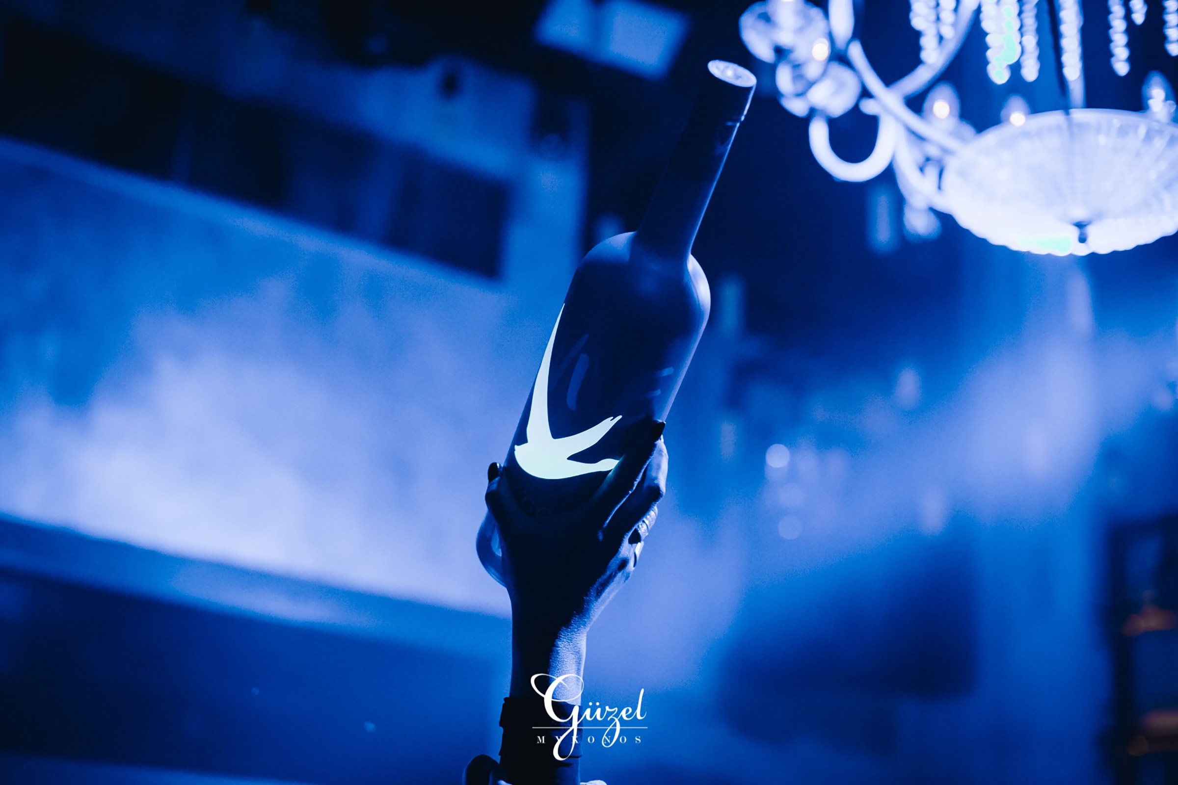 Champagne bottles come and go, professional dancers show off extremely sensual moves, VIPs move to the beat next to everyday beautiful people, IG stories go viral, and the party goes on until the sun rises and way after that. - Secondary Image