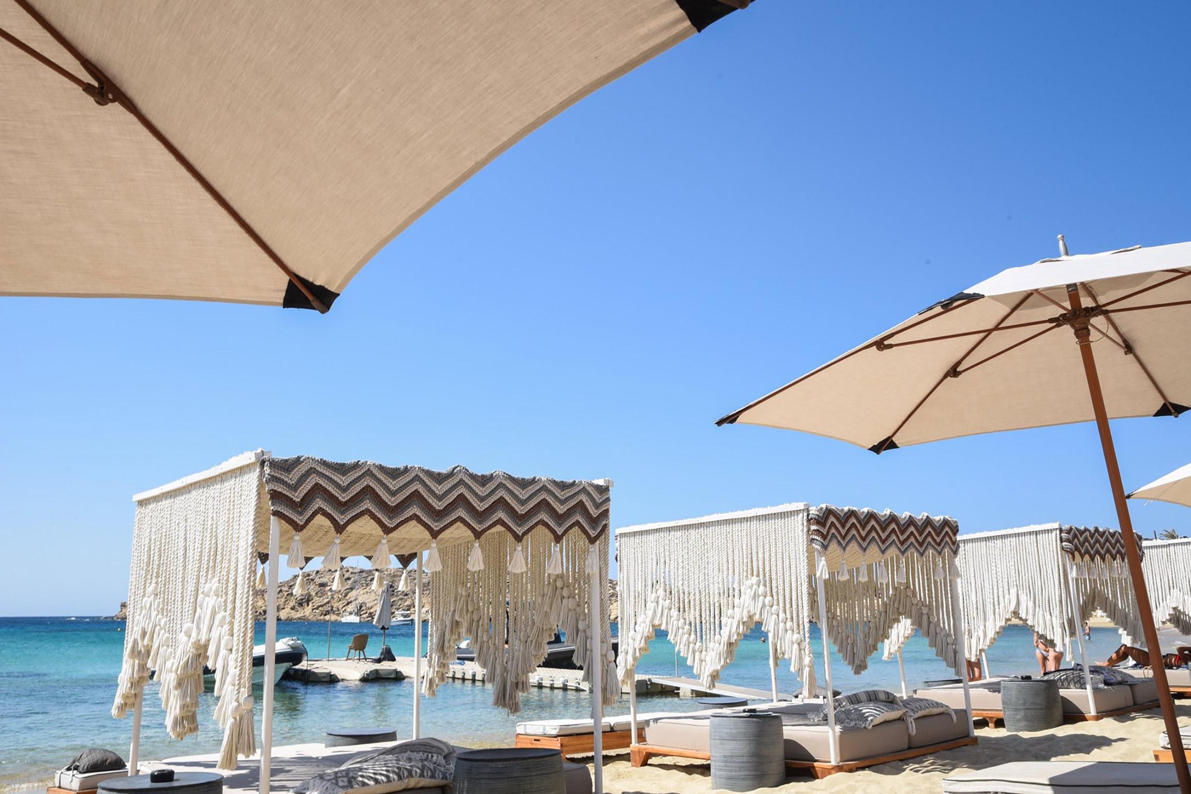 The Kalua brand begun in the late ‘70s on the island of Kos, before becoming a milestone for the crazy Athens’ nightlife scene and expanding to Mykonos, where it has been hosting some of the island’s guests’ most memorable days and nights for over 20 years now. - Secondary Image