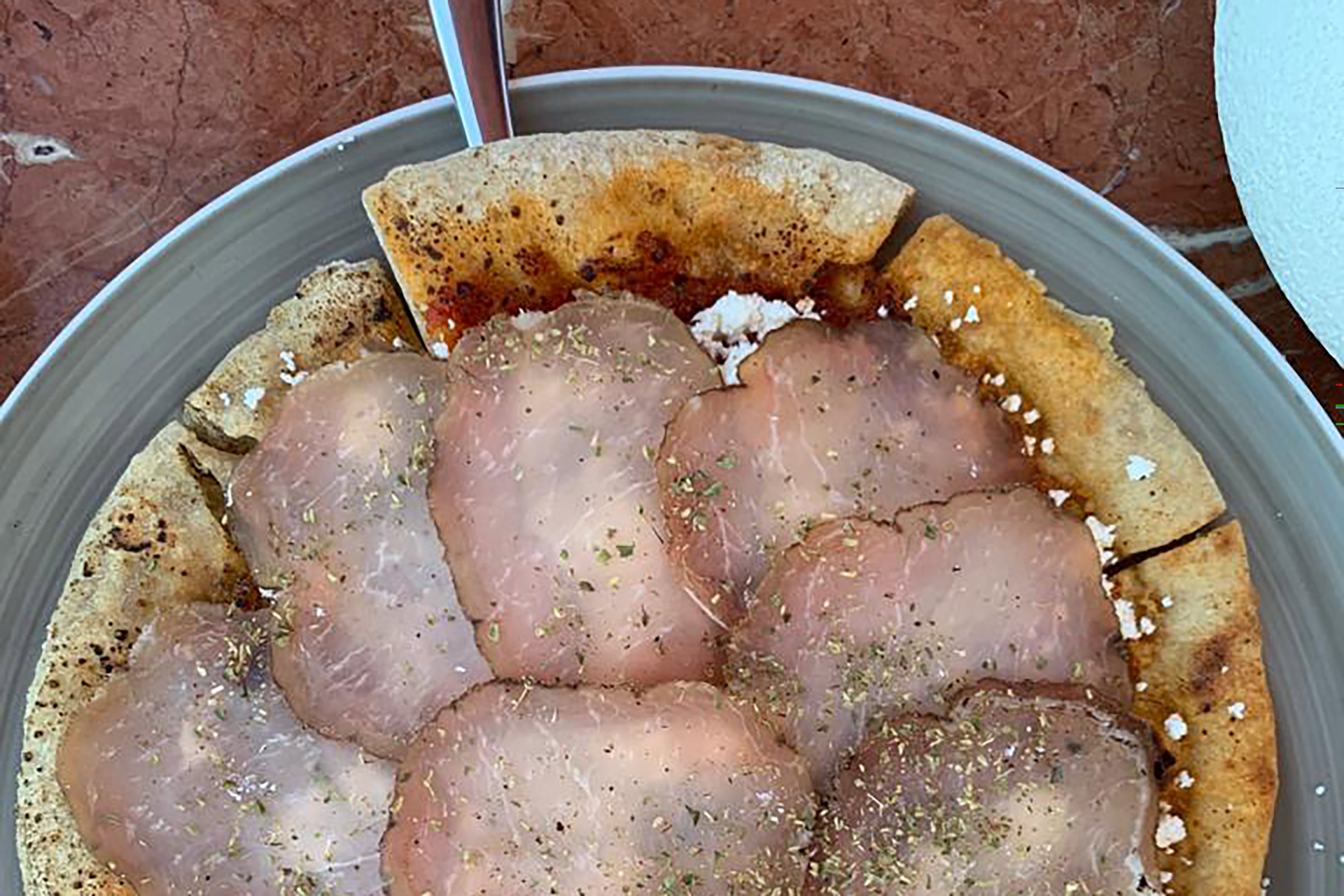 Fresh fish and seafood, raw and cooked, premium cuts, vegan delicacies, local and international ingredients, sophisticated cocktails and premium cuvees are served on both levels of the brand-new beach resto, which encapsulates the authentic Mykonos spirit in a boho-chic and luxurious manner. - Secondary Image