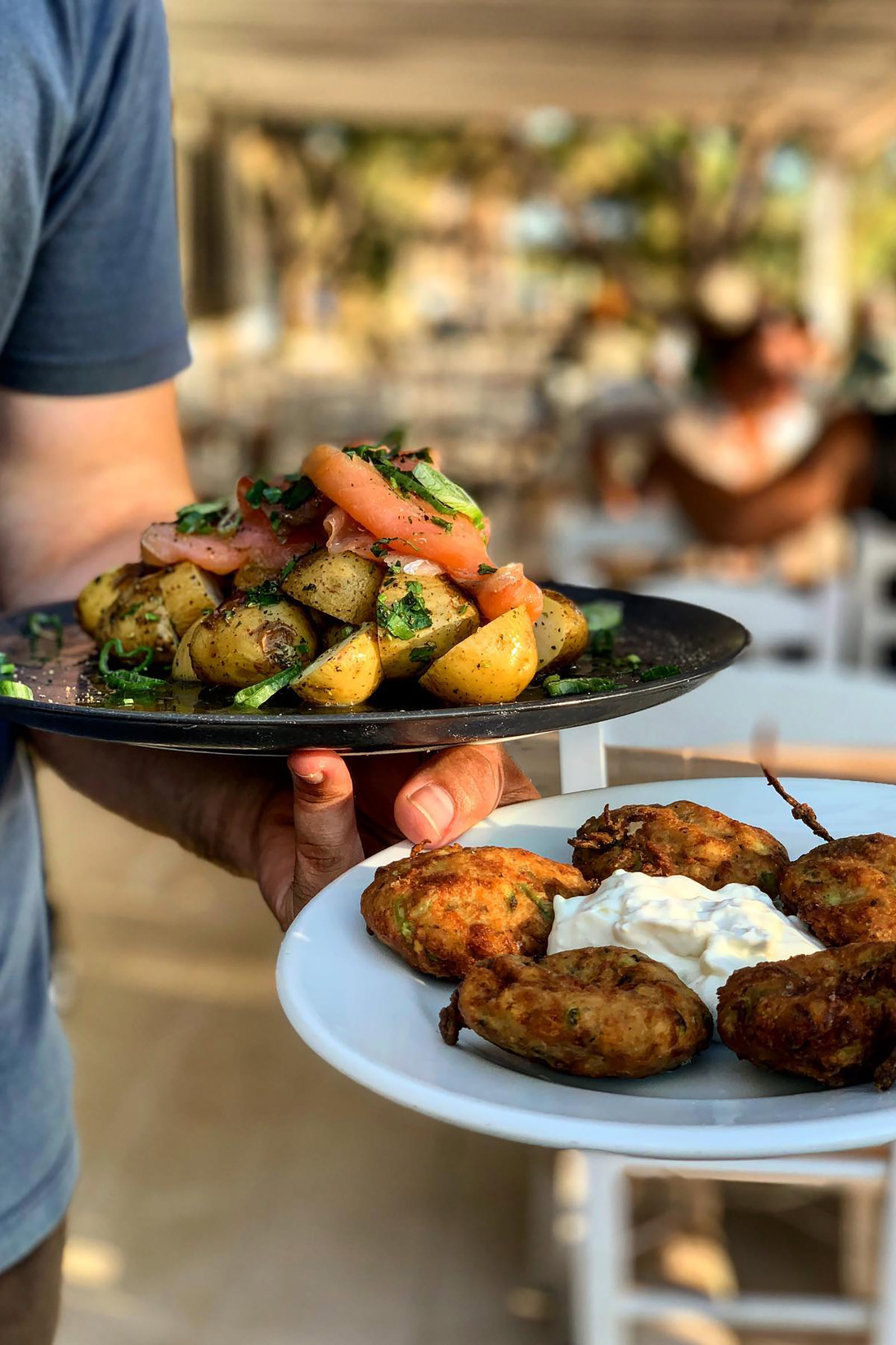 Do give the Mykonian louza (a type of local charcuterie) and sausage a try, as well as the fried zucchini balls and the feta in crust with honey and sesame. The menu boasts a large variety of fish, seafood, meat, pasta and traditional Greek dishes, so almost everyone will find for sure a personal favourite in this picturesque little seaside tavern. - Image