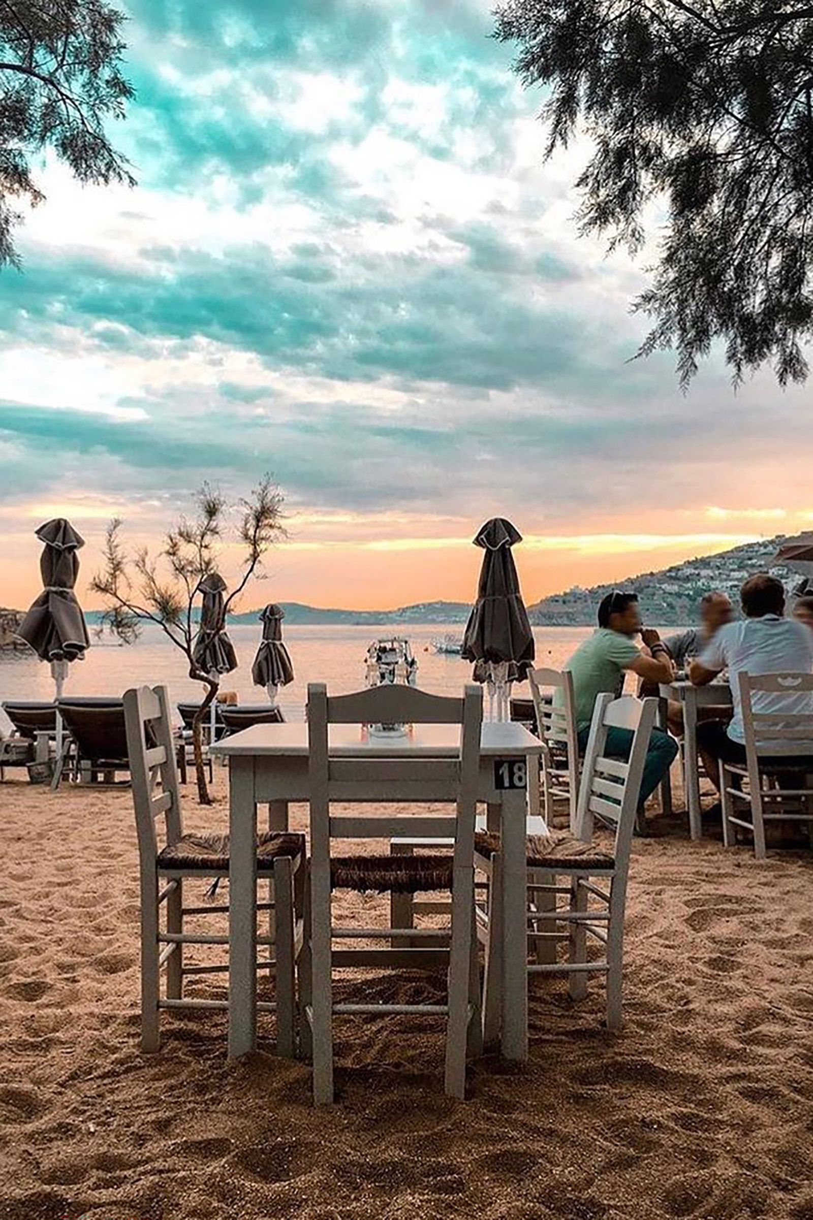 Laying all day under the sun and diving in and out of the cool Aegean sea, now that is what summer holidays are all about. But let’s make it even better, let’s add a small family tavern with amazing local cuisine, just there, on the sand, a few feet from your comfy sunbed. Now we are talking, right? - Image