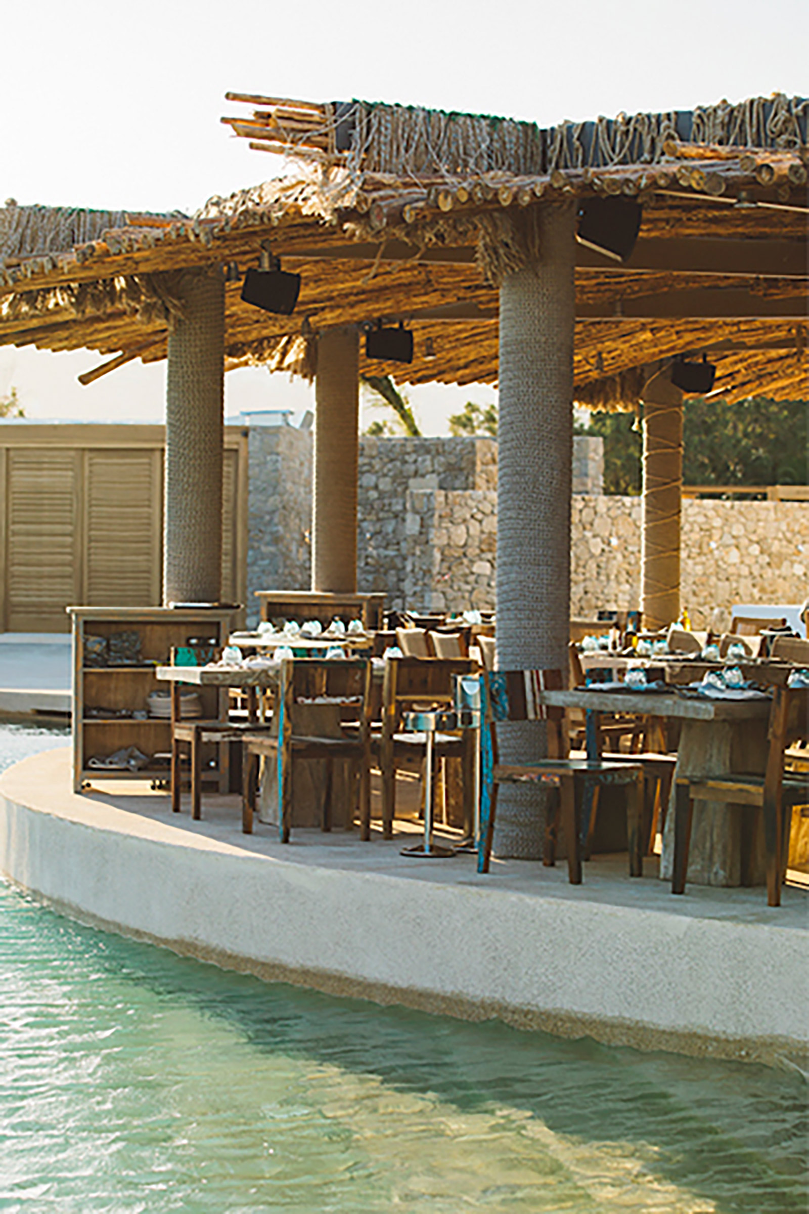 The 70 pool and beach cabanas, the numerous heavenly sunbeds, the 4 top-notch bars serving from inspired signature cocktails to vegan smoothies, the farm-to-table restaurant, and the exciting raw and sushi bar offer guests plenty of options - Image