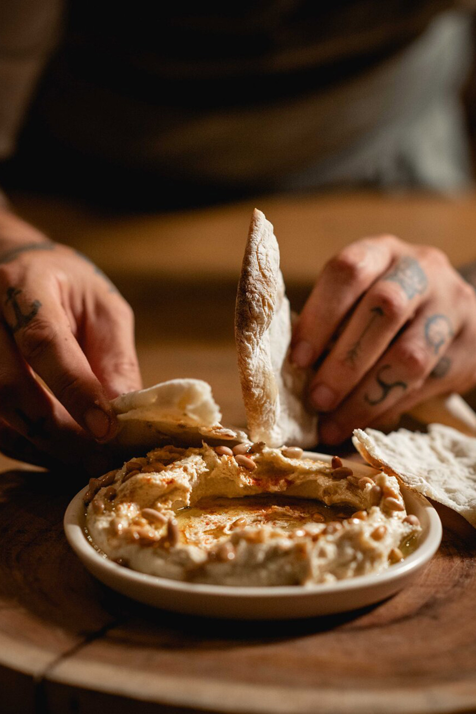 Today, Alex resides in Meze, breathing life and bringing to light some of his grandmothers’ traditional recipes, such as the dolmadakia (vine leaves stuffed with rice and herbs), the tzatziki (yogurt based traditional Greek starter) and the Imam (aubergines with tomato and garlic), and cooking over fire and embers the delicacies coming from the Mexican land and sea. - Image