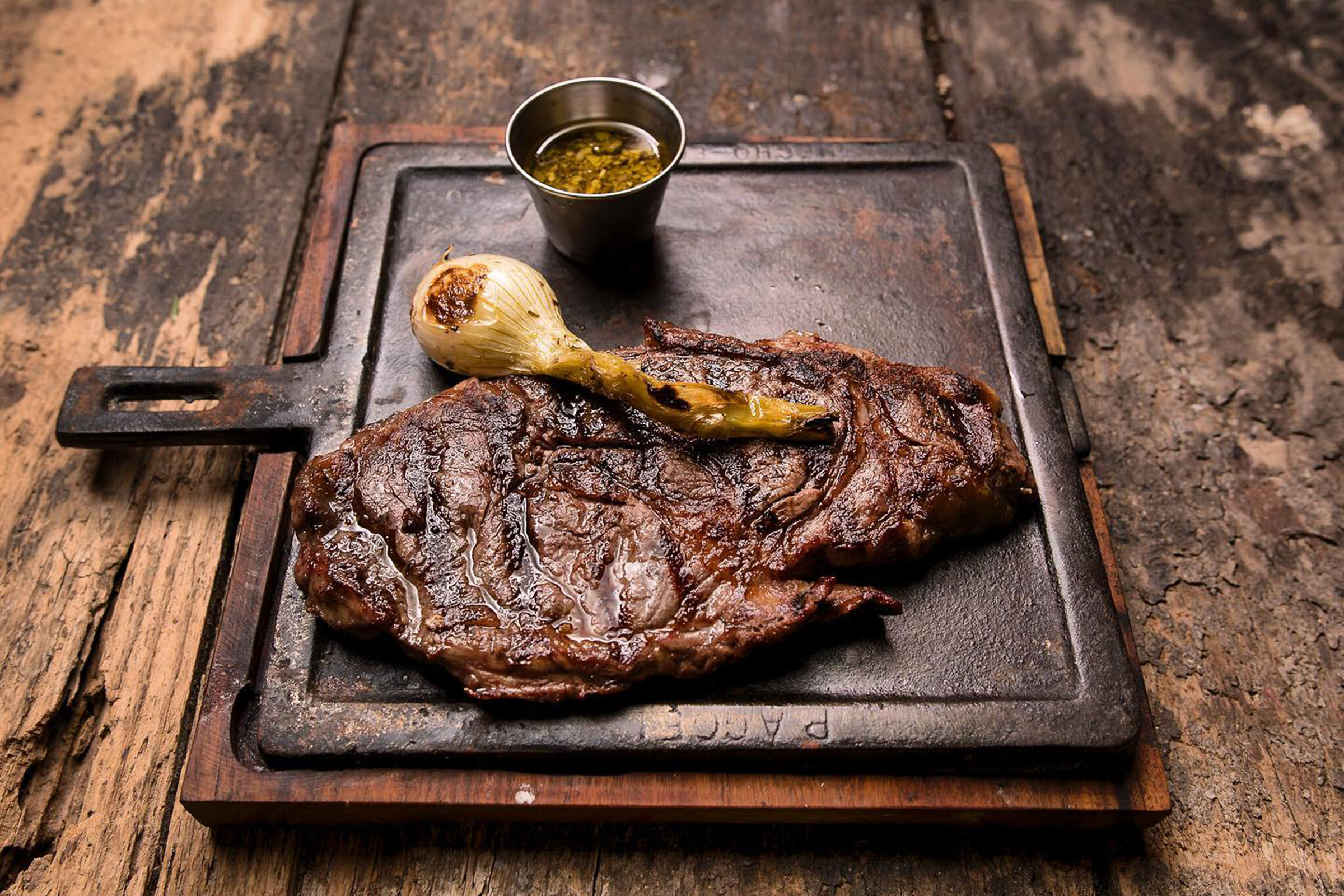 Casa Banana is a locals’ and visitors’ favourite alike, as its huge and top-quality steaks and premium beef cuts are considered maybe the best in Tulum. - Secondary Image