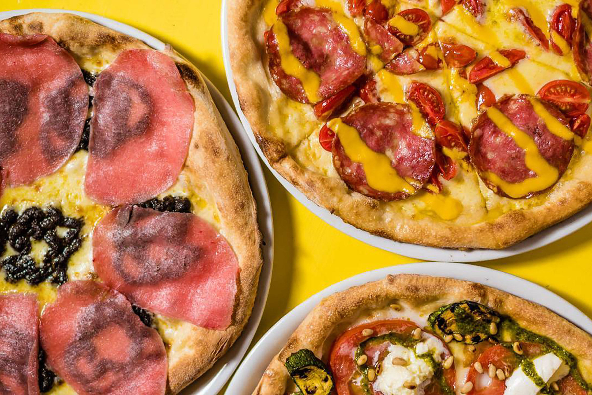 Exciting antipasti and fresh salads, homemade pasta fresca and authentic Naples-style pizza, fresh fish and quality meat cuts, sinful desserts are paired with a fine collection of wines, imported directly from Italy, and amazing cocktails to provide Catari’s eclectic guests with a cool-vibed and relaxing meeting-point for every glamorous Mykonian night. - Secondary Image