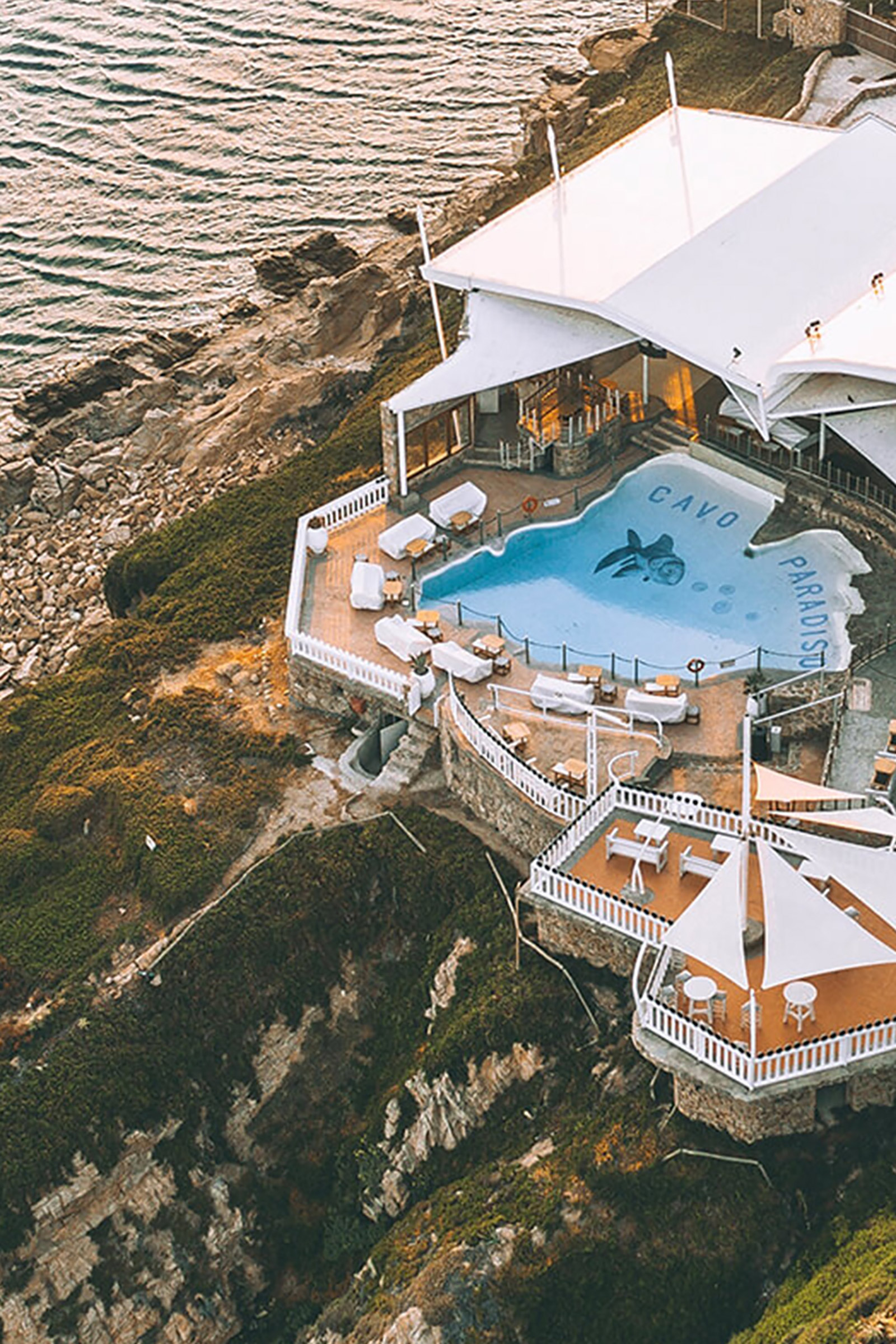 Built on the top of a feral cliff over Paradise beach, you cannot come to Mykonos and not pay a tribute to Greece’s longest running club and the venue top-listed among the world’s best clubs in various international prestigious guides and publications. - Image