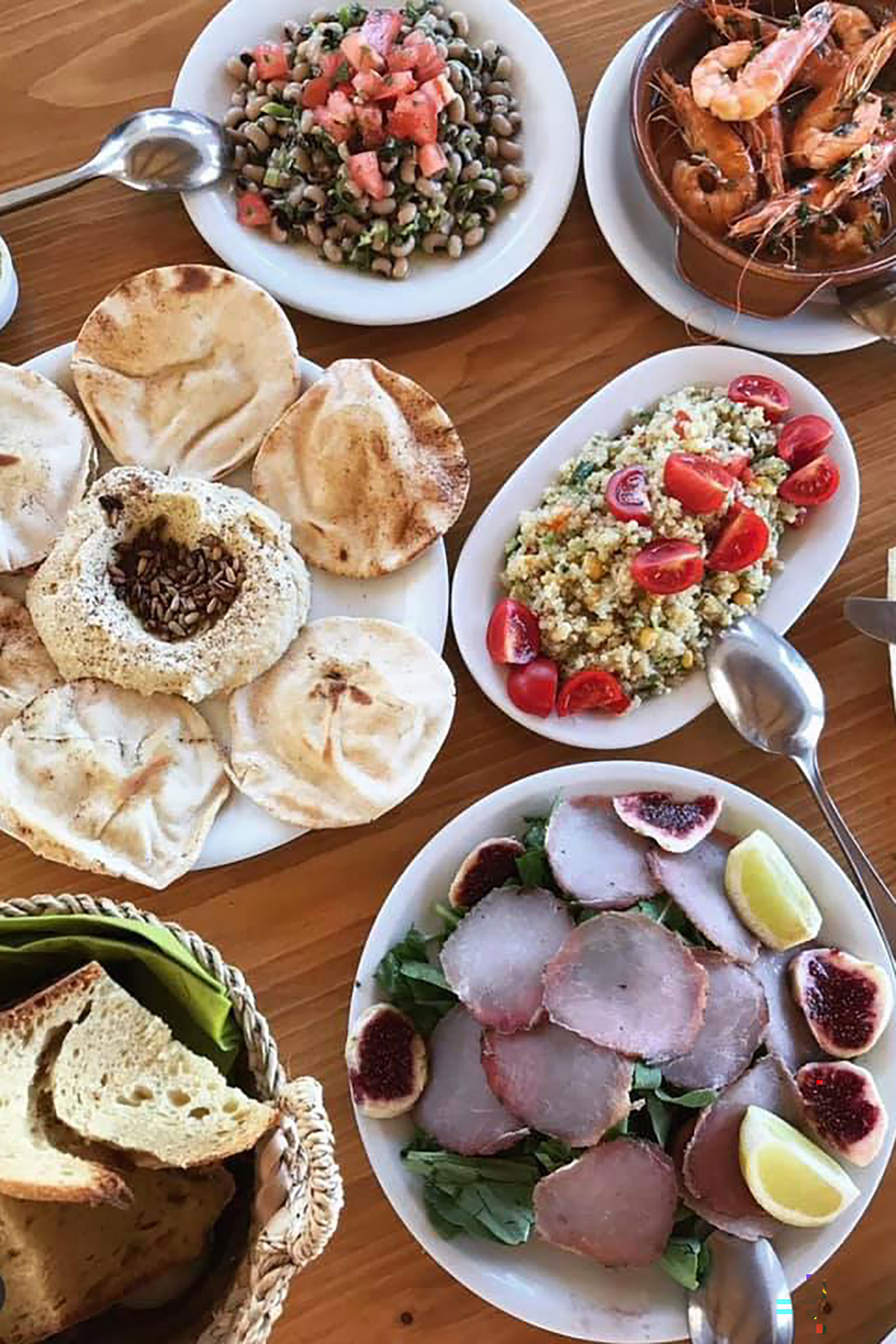 You will find amazing Greek dishes and inspired fresh salads at the one and only -literally as it is the only one here- Fokos Tavern, which is ideal for a delicious after-swimming feast. - Image