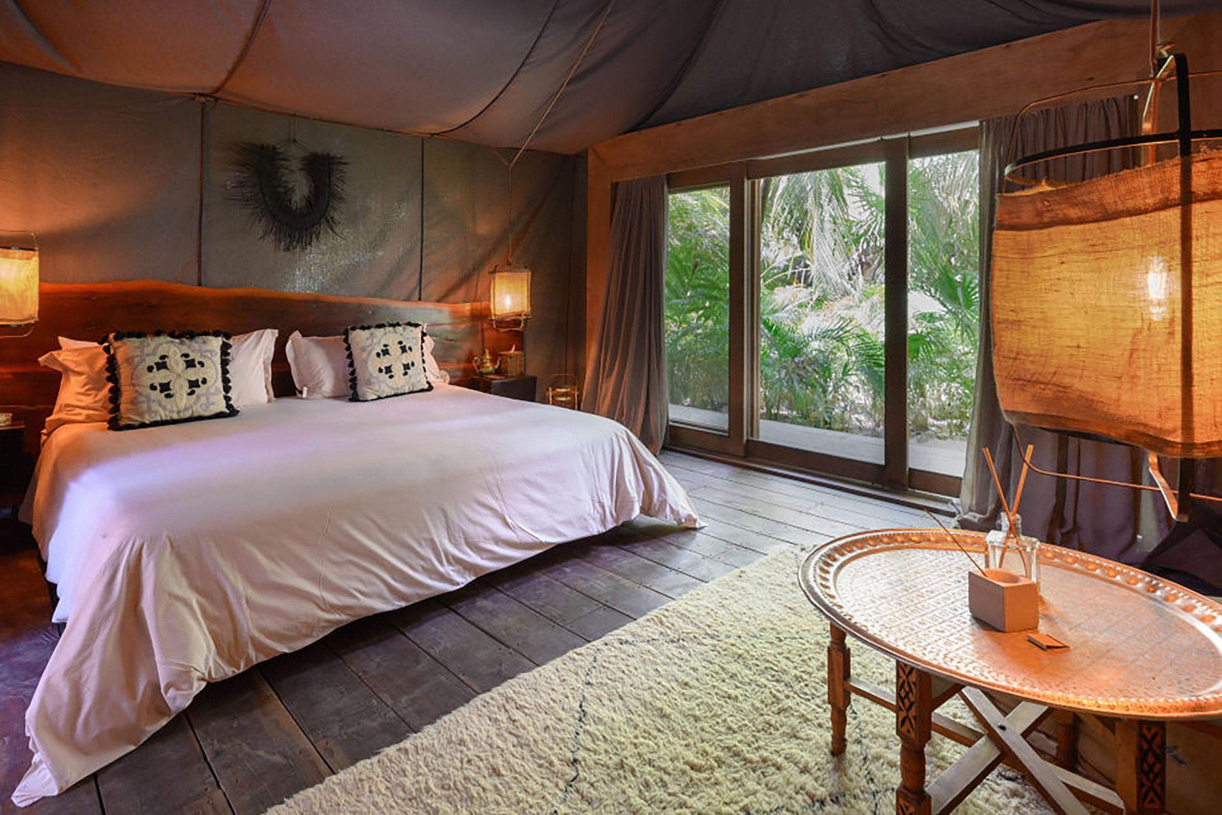 Here the contemporary traveller will have the opportunity to choose how close to mother nature he would like to be, from the 36 nomade-style rooms to the 20 exclusive suites natural materials and verdant outdoor spaces create a most unpretentious luxury feeling, while in the 5 treehouses and the 36 luxury tents things get even more interesting, if you are looking for a one-of-a-kind experience. - Secondary Image