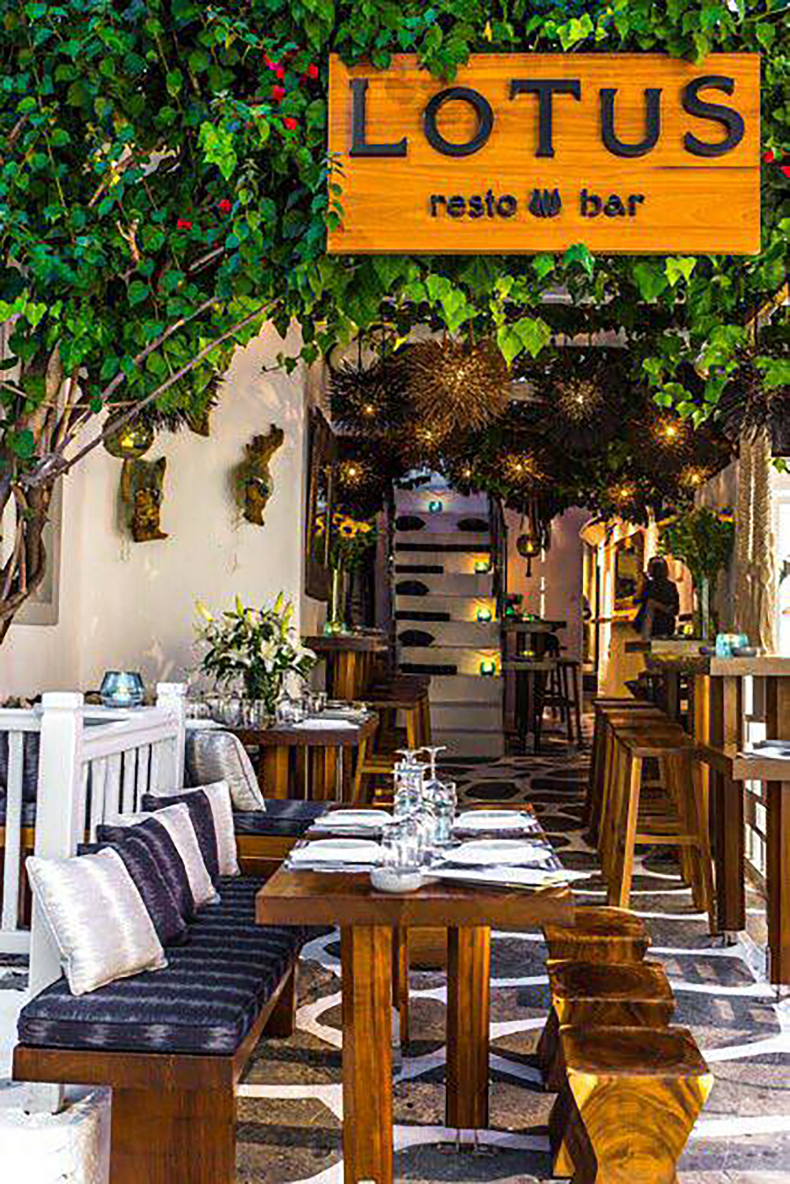 With its blooming huge bougainvillea standing against the white-washed walls and saluting its guests, and the candlelit ambiance preparing one for a romantic night out, joyful companies of friends, modern families and enamoured couples come here year after year for the delicious Greek and Mediterranean dishes, the wide wine selection, the inspired cocktail list, and the amazing music choices creating a unique ambiance of laidback luxury and unpretentious grace. - Image