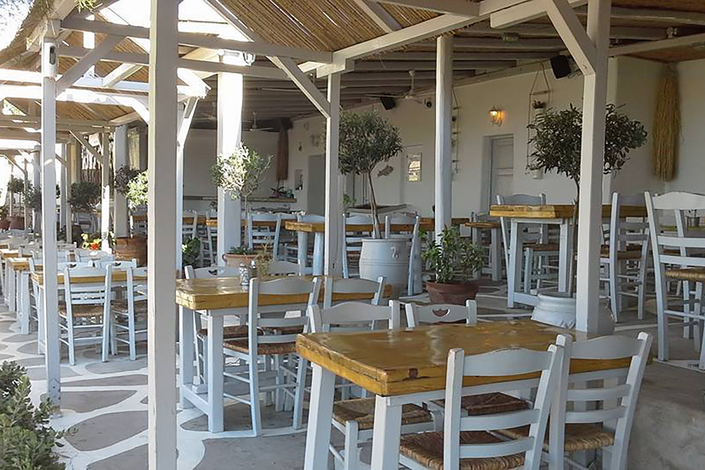 On the far-left end of the lively Paraga beach the traditional taverna of Tasos has been standing there since 1962 and can proudly declare to constitute an “alive and kicking” piece of Mykonian history, as some of the greatest celebrities of the old and new Mykonos era have been seated at its solid wooden tables, treasuring the breezy Greek summer days. - Secondary Image