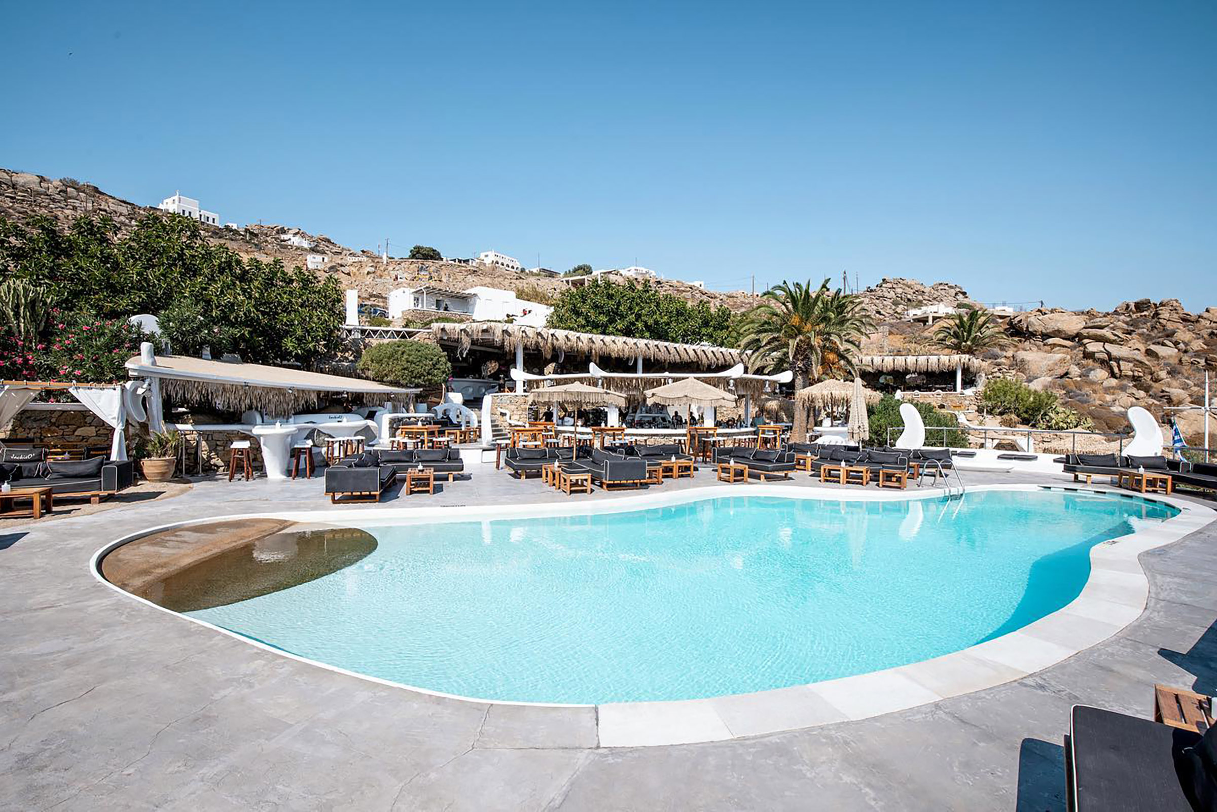 A place proudly walking on a multicultural mosaic invites you to taste the unexpected and discover the unusual every day and night, finding your favourite spot on the luxurious beach sunbeds, the futuristic poolside scenery, or the bubbly fun of the jacuzzi. - Secondary Image