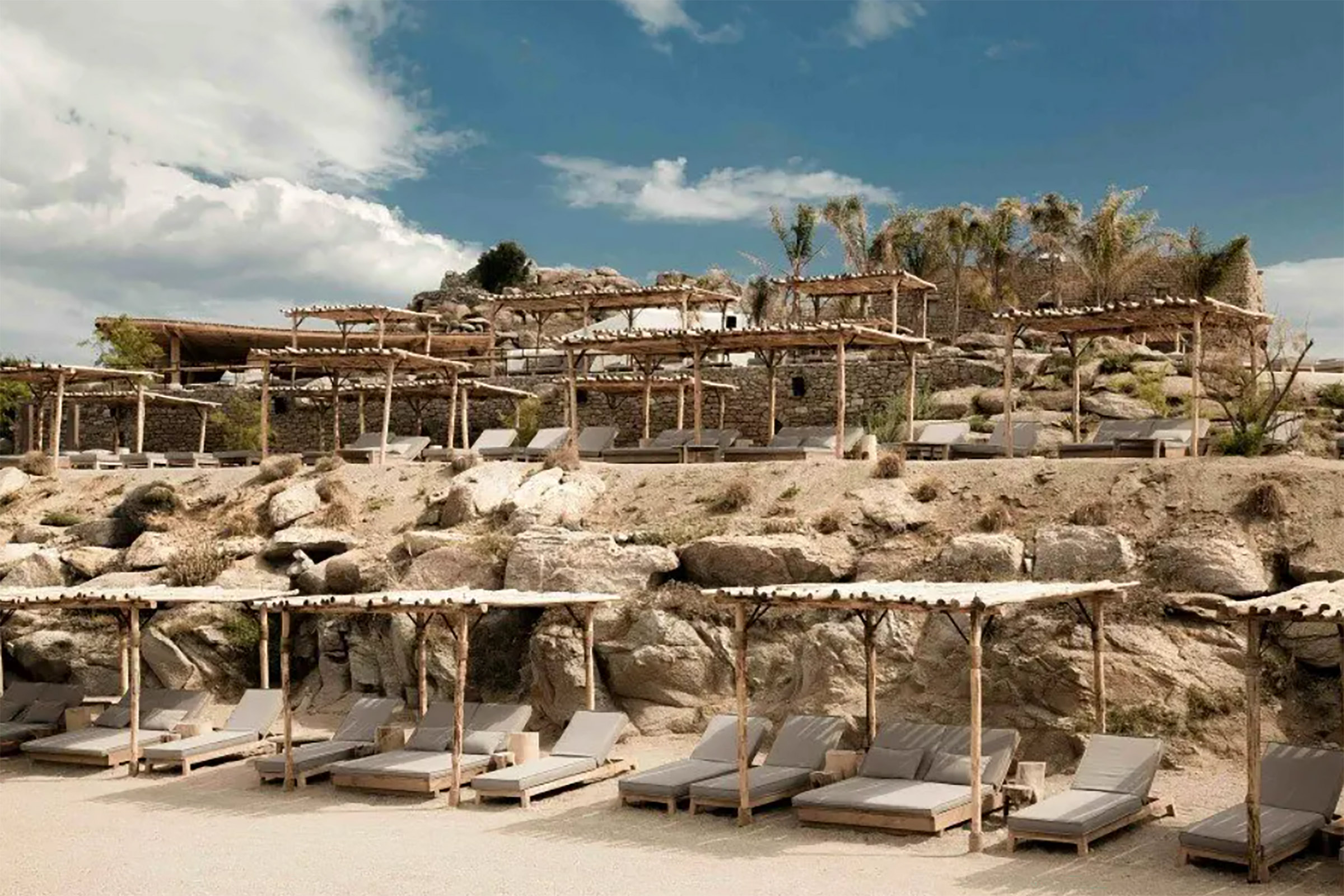 Consisting of a sandy beach, an open-plan restaurant, and a sunset beach, where the music rituals take place, Scorpios was created as a gathering place meant to host the artistic, spiritual, and social life of its community. - Secondary Image