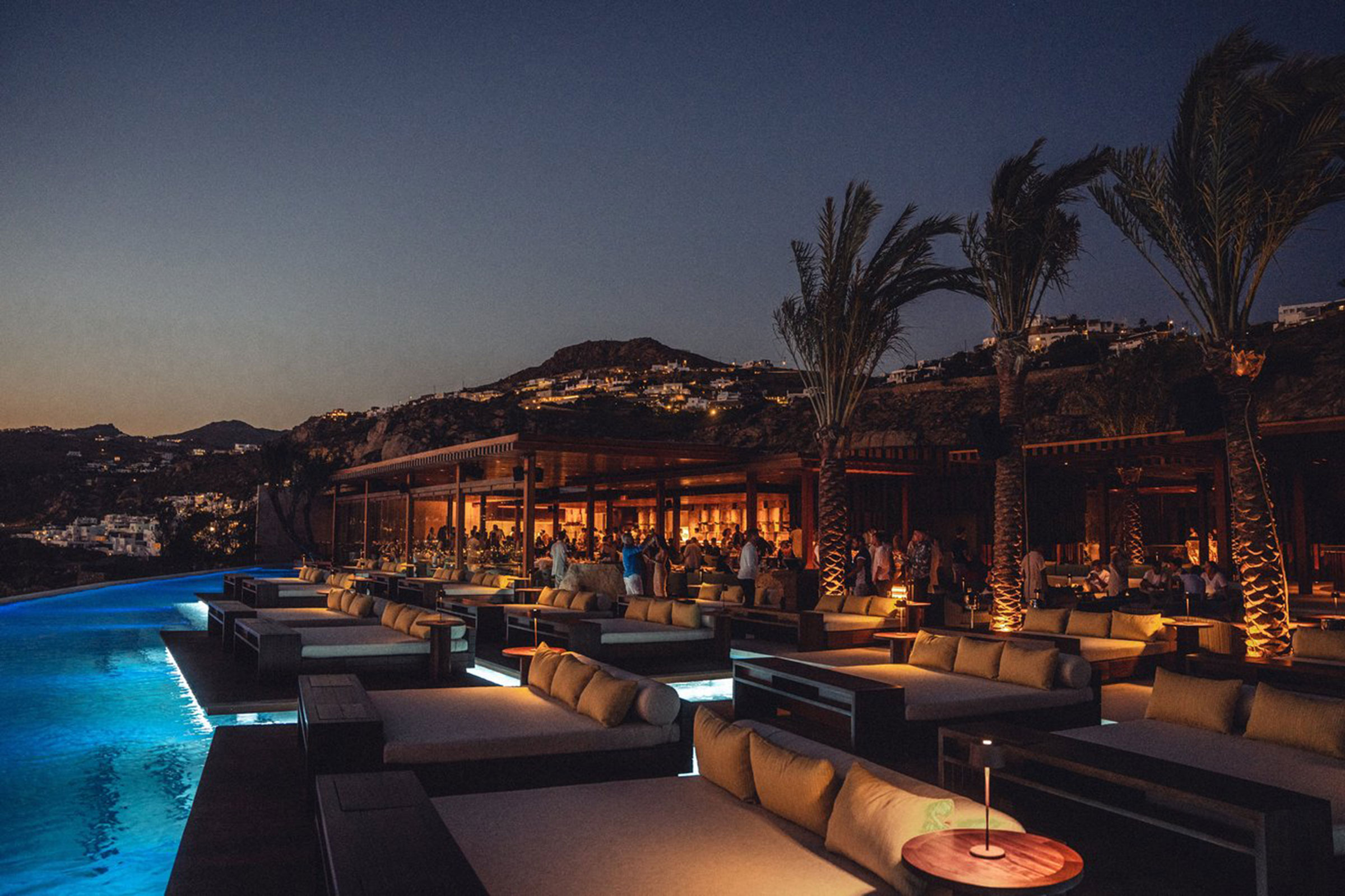 In the form of a repeating pop-up restaurant, the world-famous Zuma has landed on the island of Mykonos and calls the luxurious setting of the Cavo Tagoo infinity pool “home” each summer. - Secondary Image