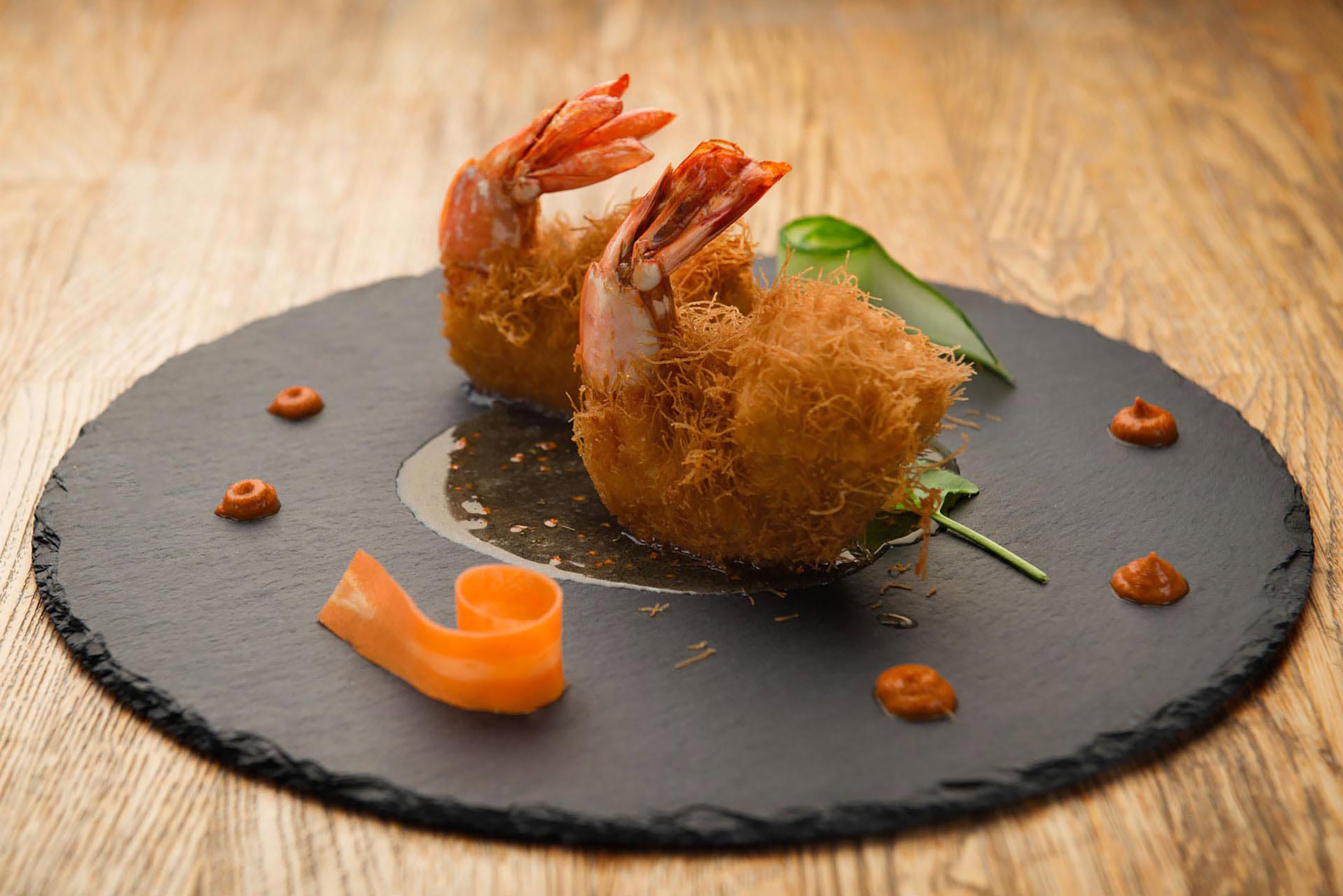 The menu is revisited every year, to keep up with the high standards of its visitors, however some dishes, such as the lamb in earthenware pot and the suckling pig with crispy crust have become “musts” due to popular demand. - Secondary Image