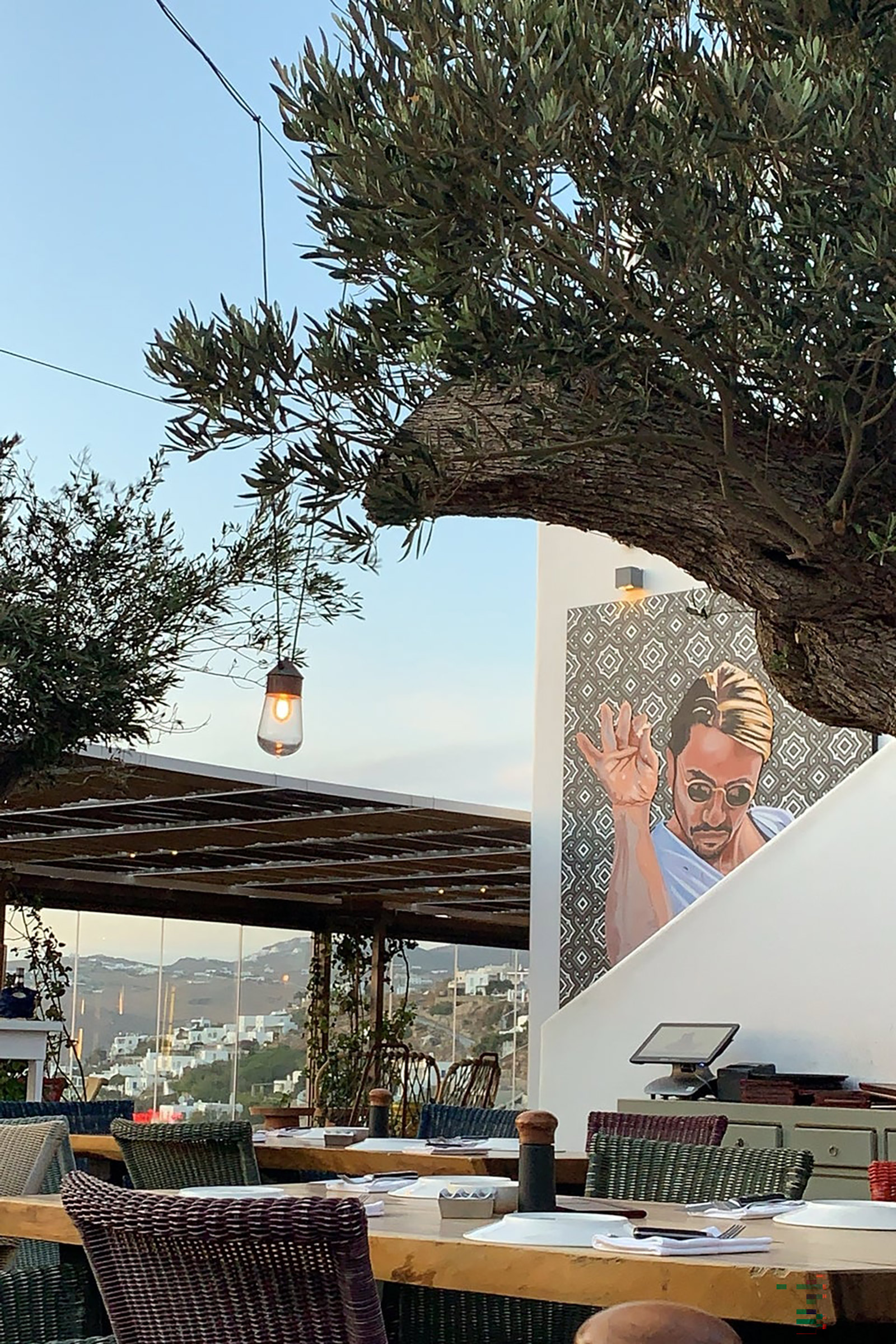 The Mykonos Town restaurant offers exquisite town and sea views, with a vast outdoor seating arrangement permitting for alfresco meat-centred feasts, frequented by celebrities, VIPs, and sworn meat-lovers alike. - Image