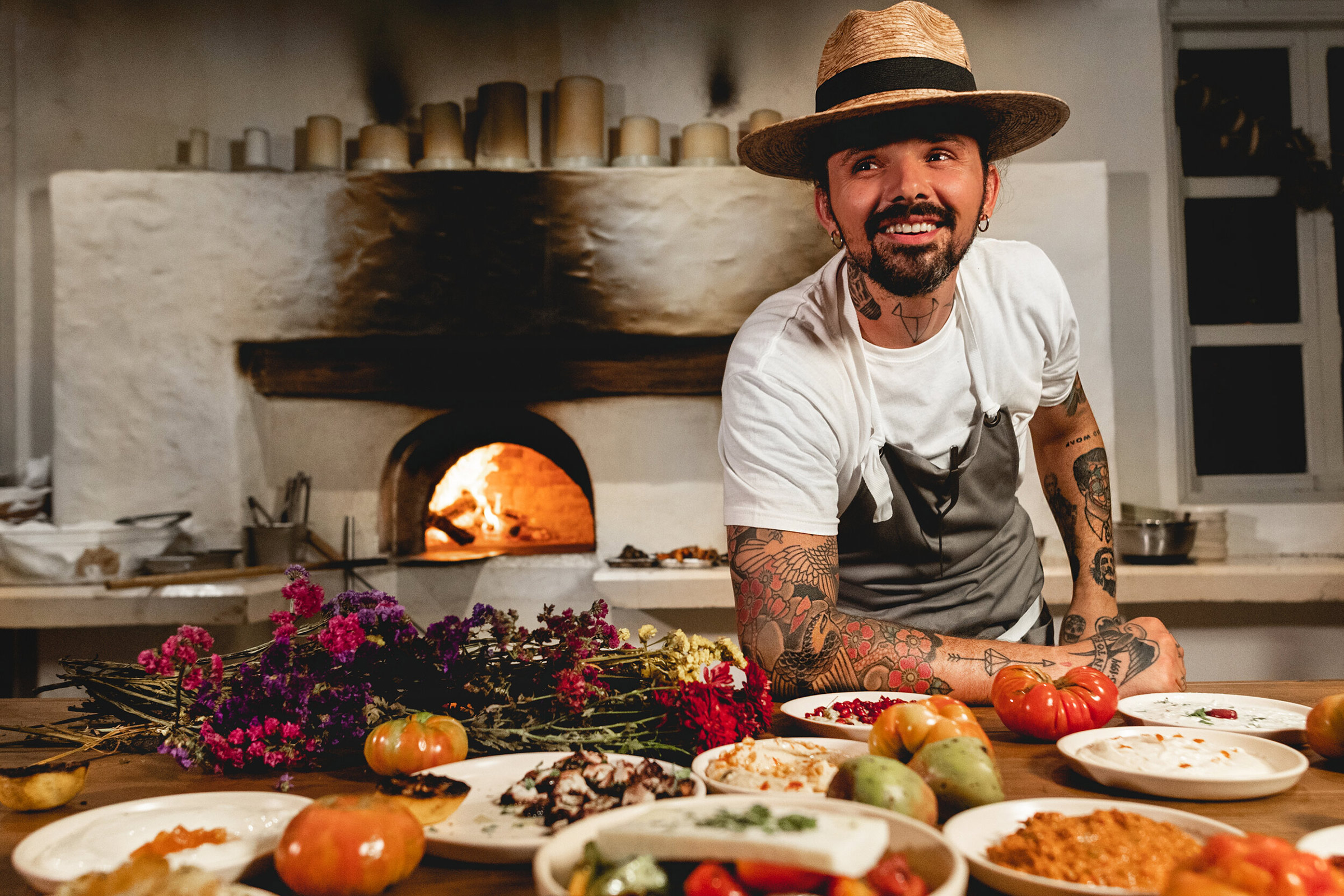 Today, Alex resides in Meze, breathing life and bringing to light some of his grandmothers’ traditional recipes, such as the dolmadakia (vine leaves stuffed with rice and herbs), the tzatziki (yogurt based traditional Greek starter) and the Imam (aubergines with tomato and garlic), and cooking over fire and embers the delicacies coming from the Mexican land and sea. - Secondary Image