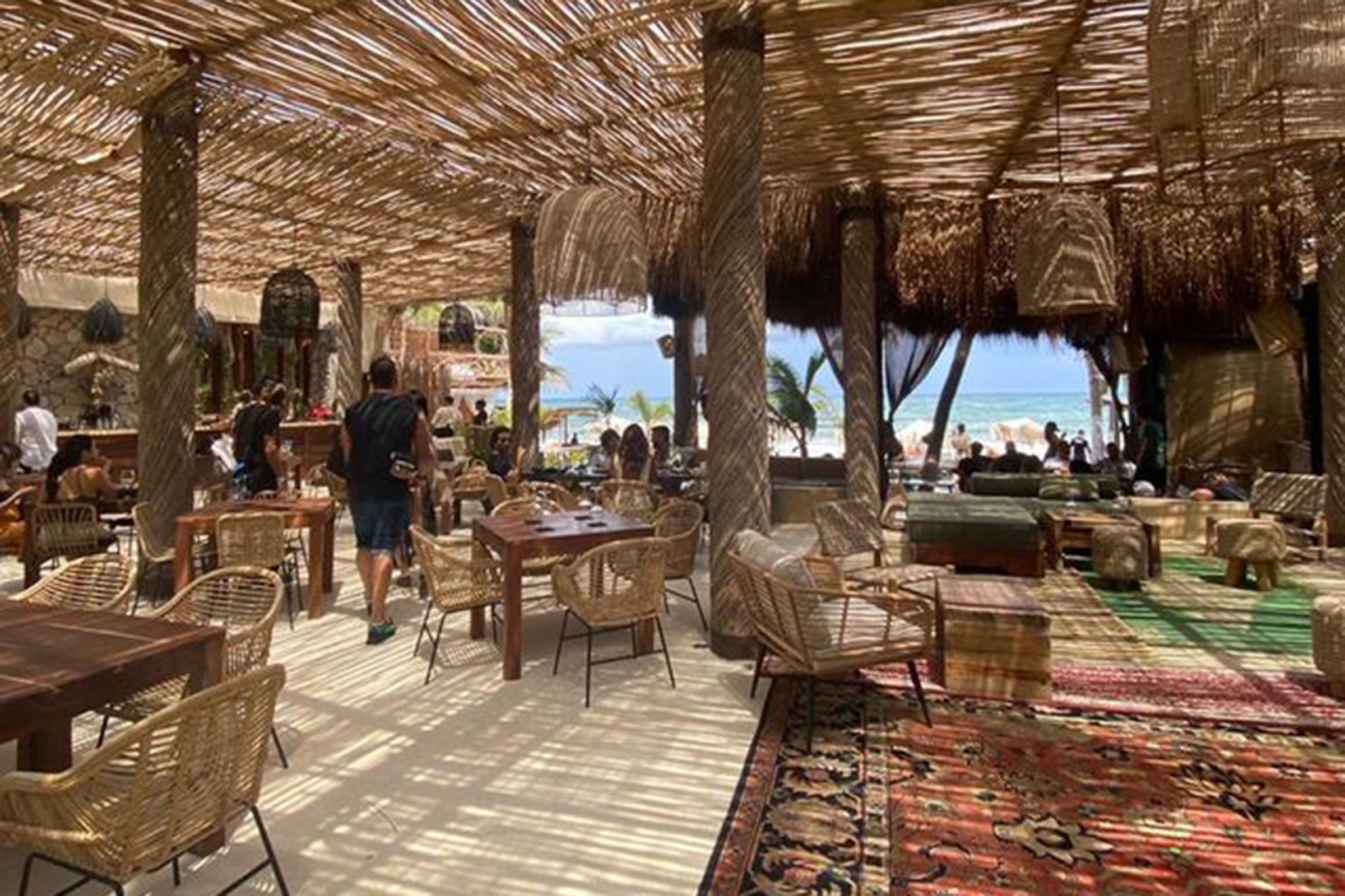 Walking down the jungle-like path from the entrance to the main restaurant, where Asian-styled carpets have been laid directly on the sand, you instantly get the feeling that here you will get the chance to totally unwind and relax. - Secondary Image
