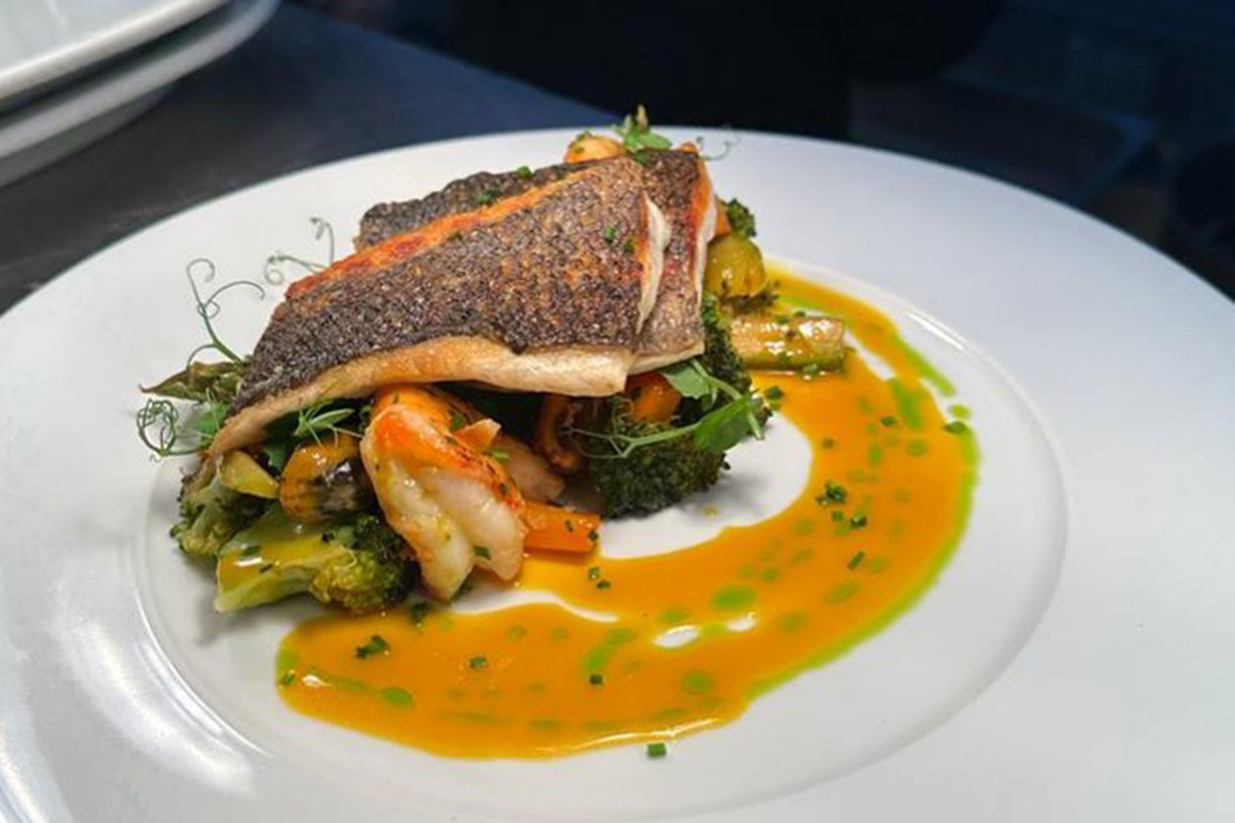 From the freshest beef tartare to the splendid signature moussaka, from the traditional pies or the stuffed summer vegetables to the elegant asparagus soup or the coq au vin, and from the Instagram famous chateaubriand with the finely cut french fries to the exquisite tarte tatin with vanilla ice-cream (a definite “must”), here you will experience a night well-spent in every possible aspect. - Secondary Image