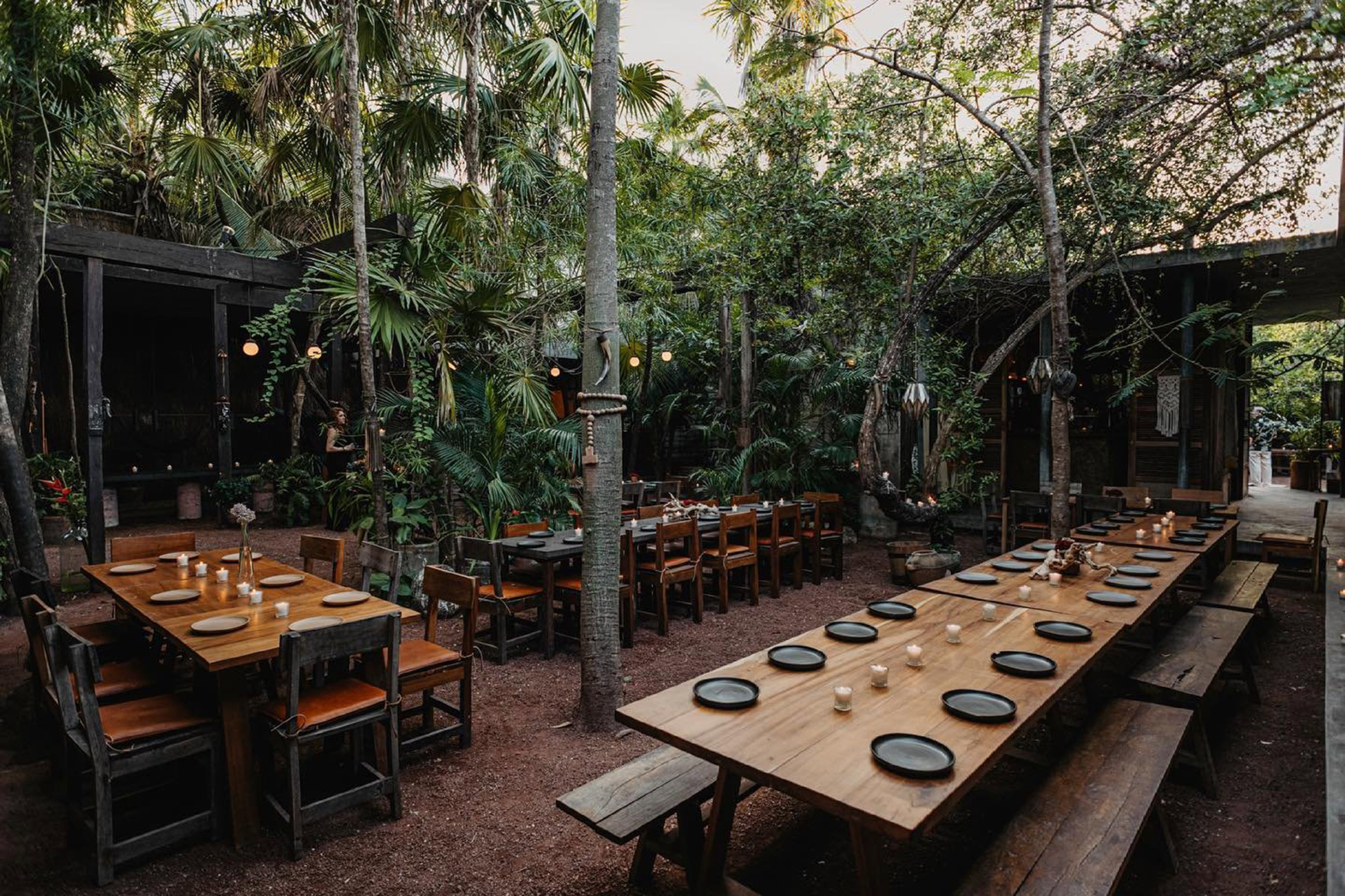 Raw concrete and solid rock, lush vegetation and flickering candle lights, thick rolling clouds of copal and a strong jungle feel. This is Casa Jaguar, a barefoot-luxury restaurant bar focusing on local ingredients, open fire cooking techniques and a boho-chic feeling of freedom for all who choose to pass its smooth wooden doors. - Secondary Image