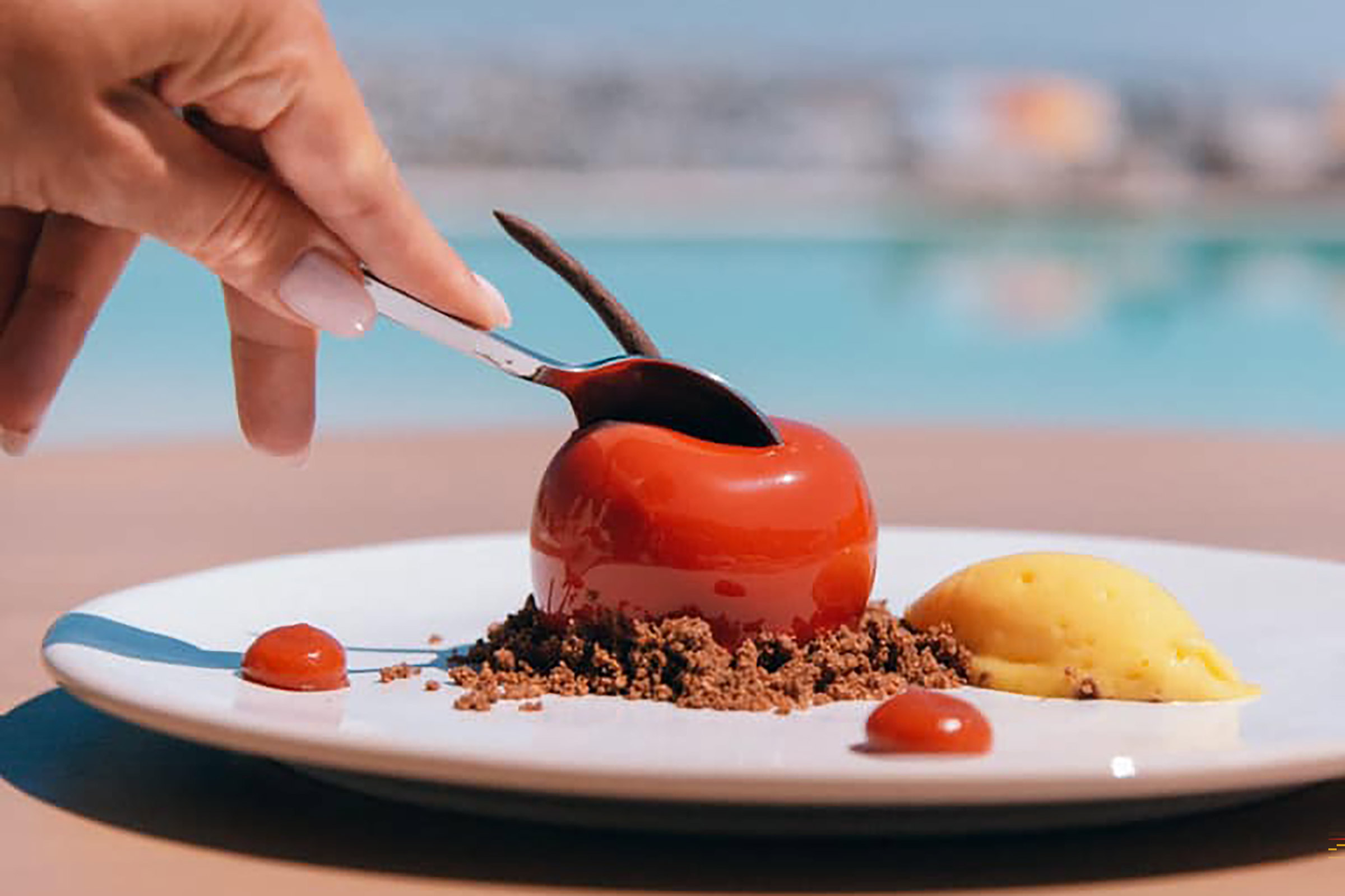 Here the well-known Pacha “pool scene” with the restaurant, the lounge and the bar, captures the very spirit of Ibiza and blends it with the unique Greek-island summer lifestyle. - Secondary Image