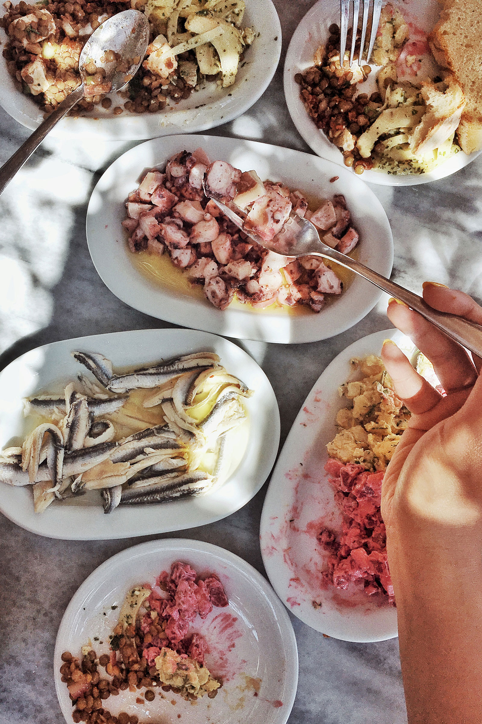 Everything, including the famous steaks and the pork chops, is cooked in the stone-built grill outside, while you can visit the small inside area to pick your salads from a vast variety of greeneries and cold dishes. - Image