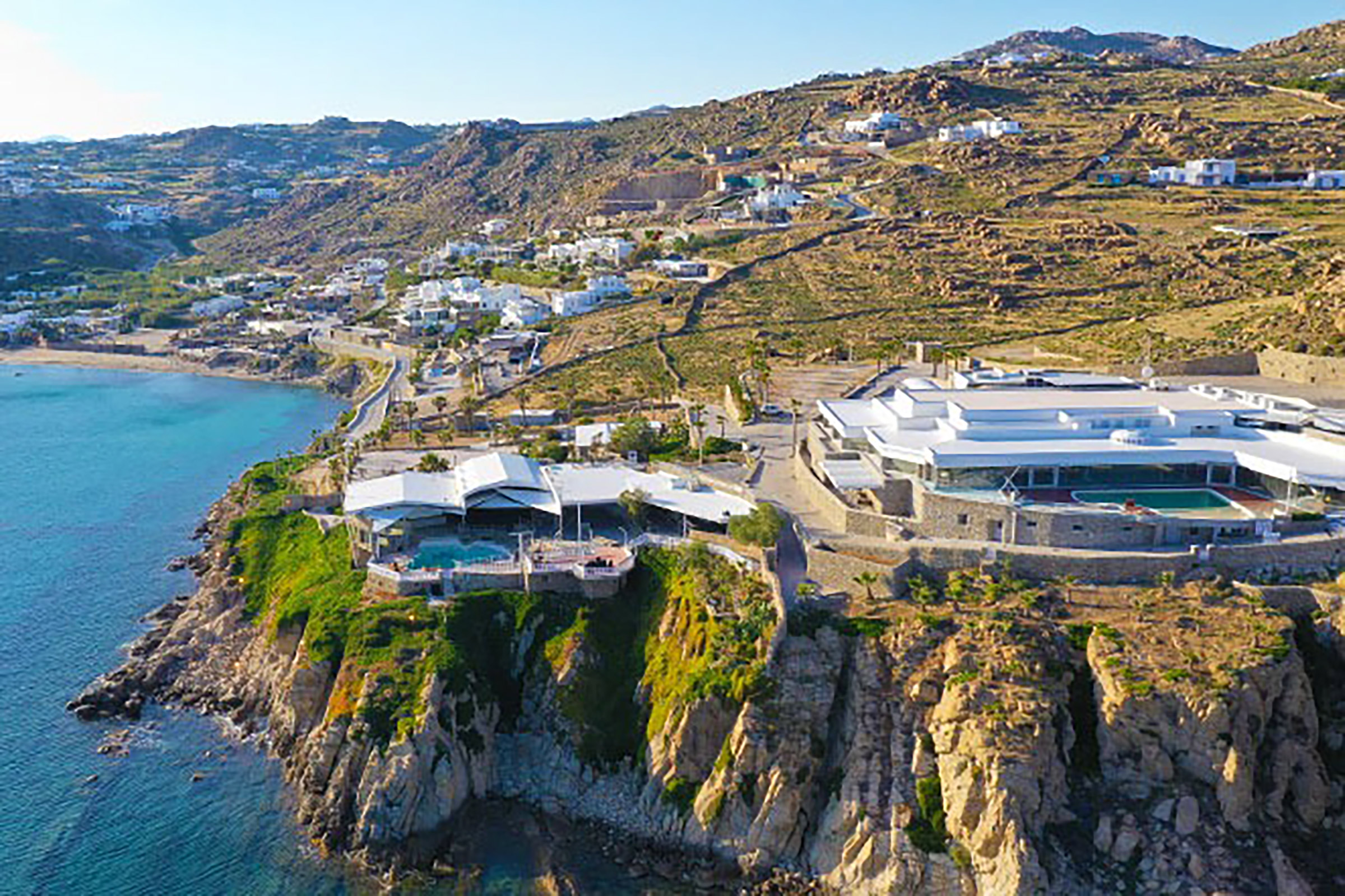 Built on the top of a feral cliff over Paradise beach, you cannot come to Mykonos and not pay a tribute to Greece’s longest running club and the venue top-listed among the world’s best clubs in various international prestigious guides and publications. - Secondary Image