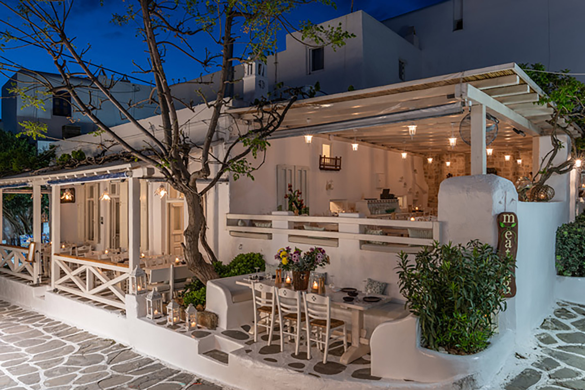 Hosted in a traditional Mykonian building of the early 20th century, just a breath away from the bustling Matoyianni, this ultra-cute, contemporary Greek restaurant offers amazing dishes that bring together the rich culinary history and gastronomic culture of Greece with the latest influences of the international restaurant scene. - Secondary Image