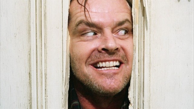 Jack Nicholson’s demonic face protruding from a hole in a door from the famous “Here’s Johnny” scene in the movie The Shining.
