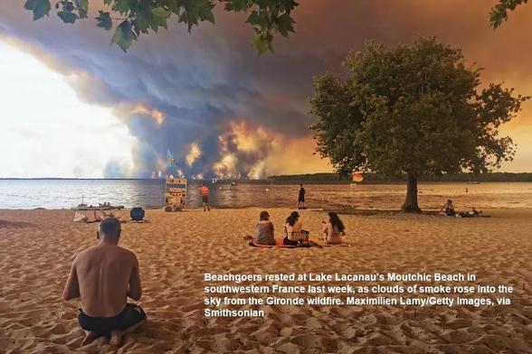 Beachgoers rested at Lake Lacanau's Moutchic Beach in southwestern France last week, as clouds of smoke rose into the sky from the Gironde wildfire. Maximilien Lamy/Getty Images, via Smithsonian
