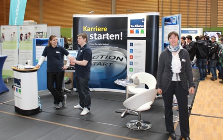 TecAlliance trainees Isabel Peter (left) and Paul Hensinger with training manager Kerstin Langohr at the stand in Weikersheim, Germany.