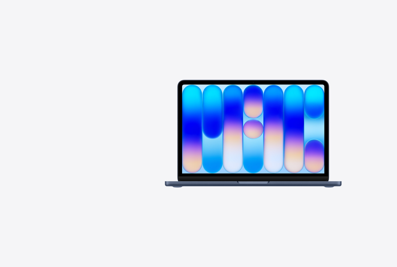 MacBook Neo, otvorený, indigová farba, farebná abstraktná tapeta