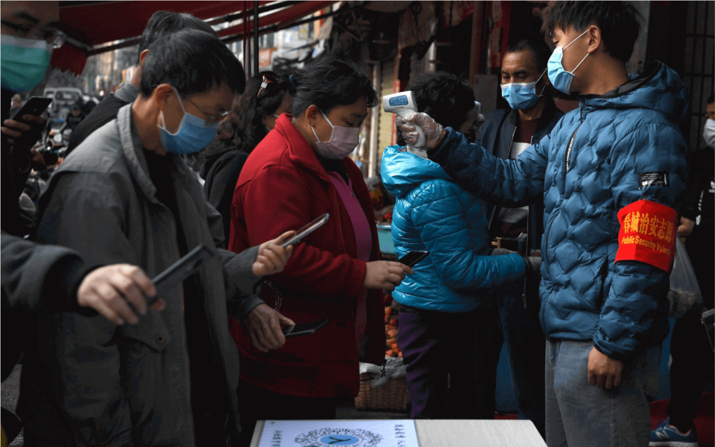 Chinese citizens use QR Codes to enter a market to go shopping during the coronavirus pandemic