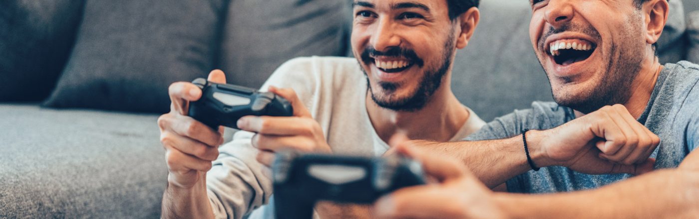 Two Young Men Playing Video Game