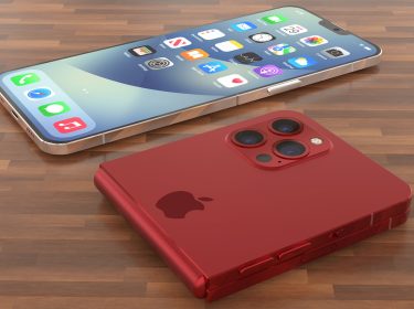 Konzeptdesign: Ein faltbares iPhone in Rot liegt auf einem Holztisch.