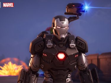 Auf dem Bild im Artikel zu den besten kostenlosen Nintendo-Switch-Spielen ist Iron Man zu sehen. Die animierte Figur steht zentral im Bild. Sie trägt einen silber-schwarzen Ganzkörperanzug aus Stahl. Auf der Brust leuchtet ein rotes Sechseck. Auch die Augen des Anzugs leuchten rot. Am Rücken scheint am Anzug eine Art Kamera oder Waffe befestigt zu sein, die blau leuchtet. Im Hintergrund sieht man eine feurige Explosion.