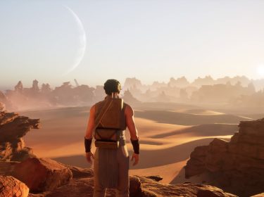 Ein:e Spieler:in steht auf einer Felsformation in Dune: Awakering.