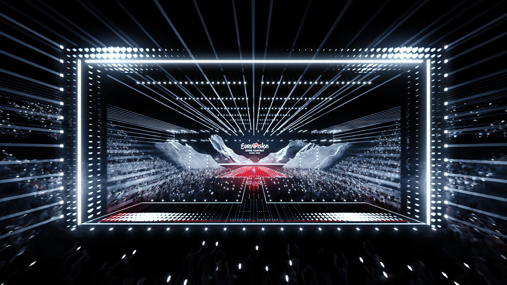 Das Bild zu den GigaTV-Highlights im Mai zeigt die futuristische Bühne des Eurovision Song Contest 2025 in Basel. Von einem Meer aus Zuschauerlichtern umgeben, dominiert ein geometrisch inszeniertes LED-Bühnendesign die Szene. Helle Lichtstrahlen und eine symmetrische Linienführung lenken den Blick auf das ESC-Logo im Zentrum – die Atmosphäre ist elektrisierend und voller Spannung.